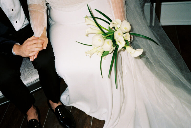 Bride's white calla lily bouquet at an intimate international elopement ceremony