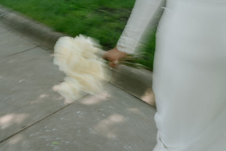 Newlyweds walking together after a micro wedding ceremony abroad with twenty guests