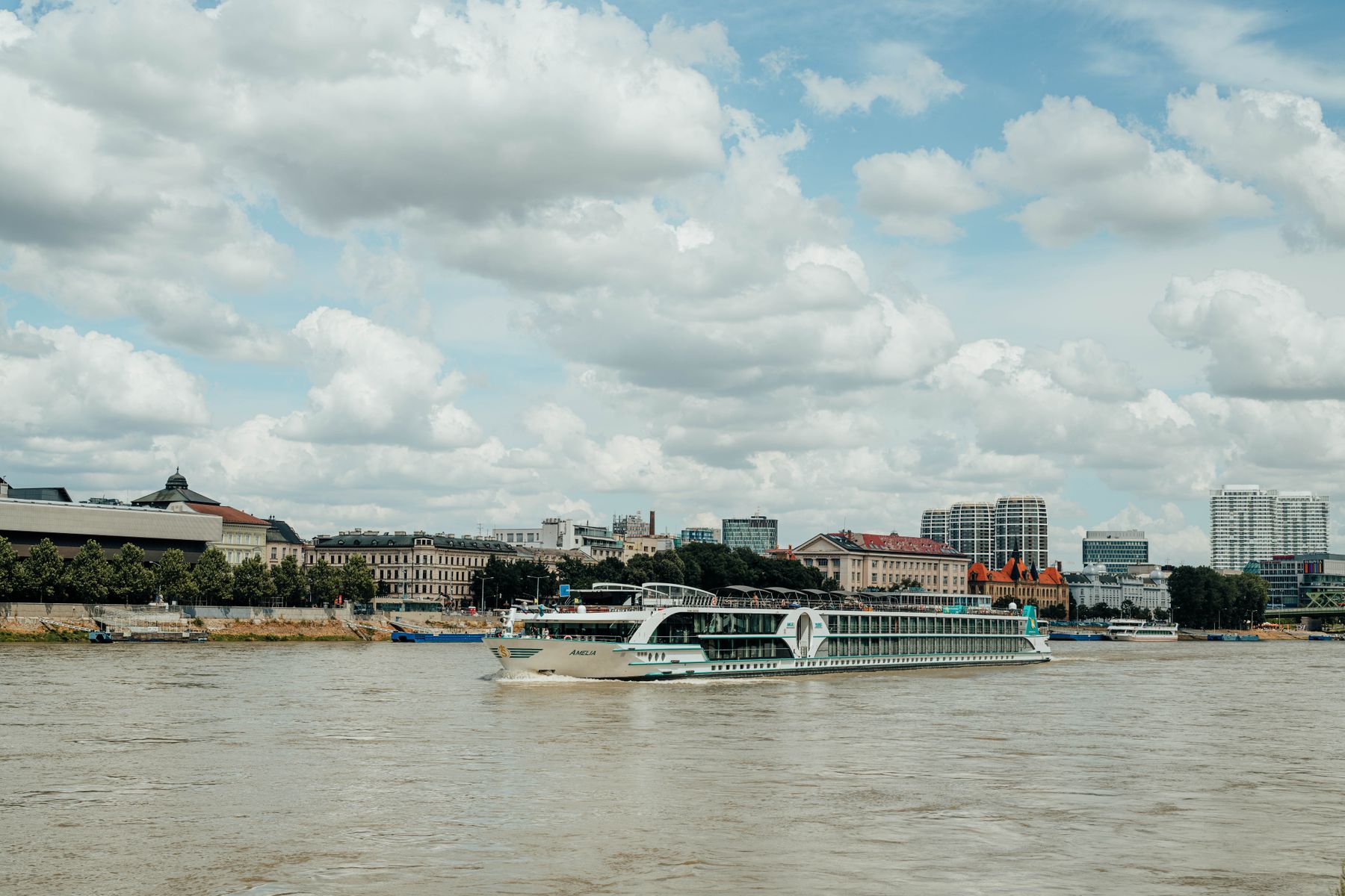 River cruise ship sailing the Danube River past the Bratislava waterfront in Slovakia