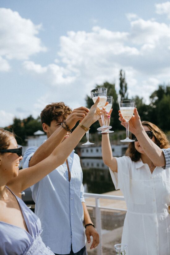 Friends toasting champagne on a birthday trip