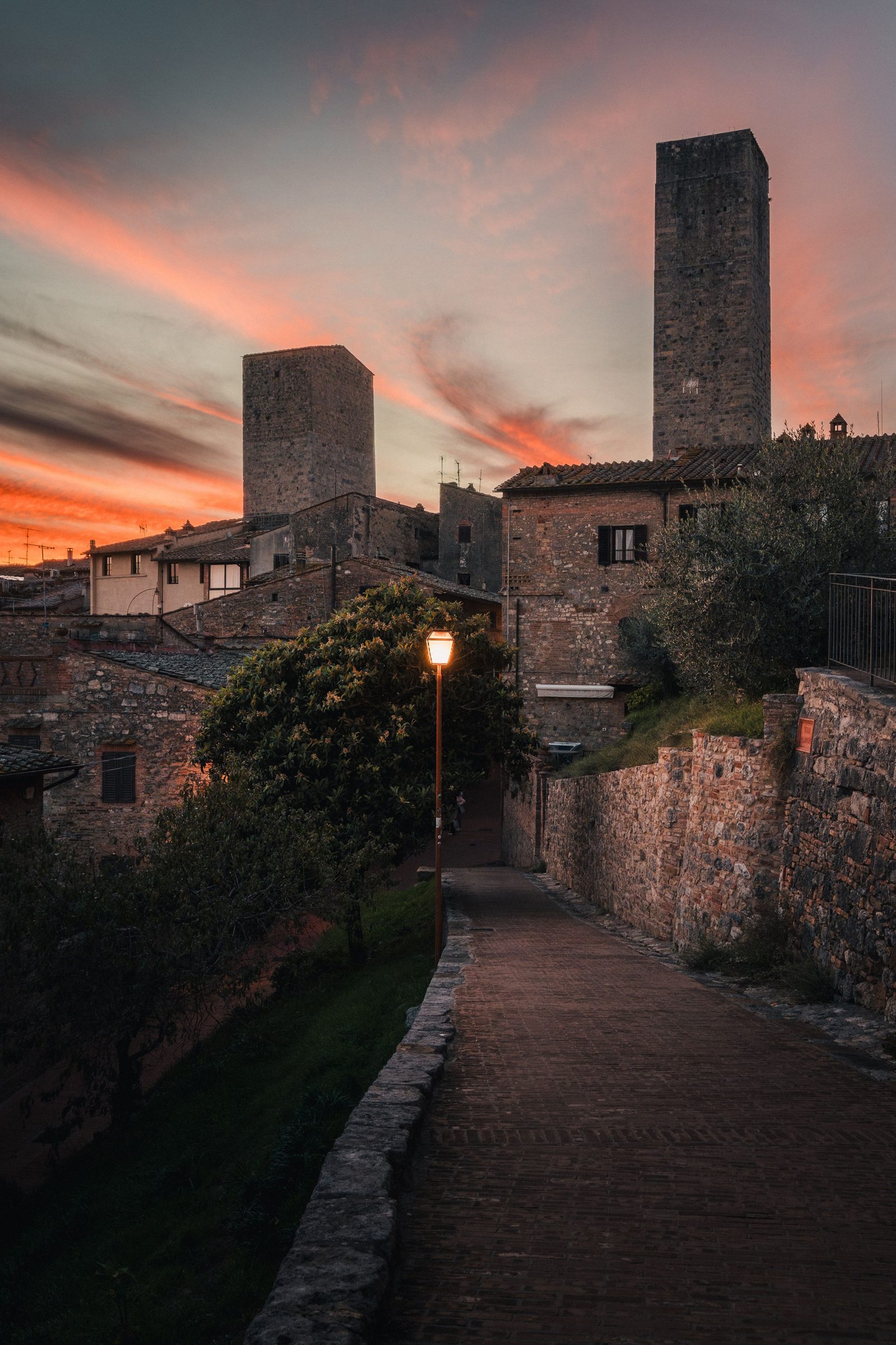 Medieval towers of San Gimignano at sunset, a highlight of private Tuscany wine and food tours